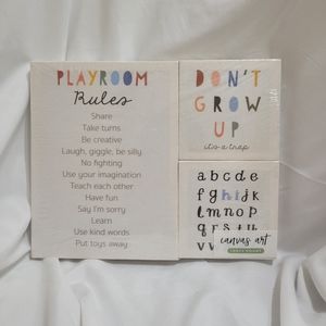 Children's "Playroom Rules" rainbow themed wall art canvases.